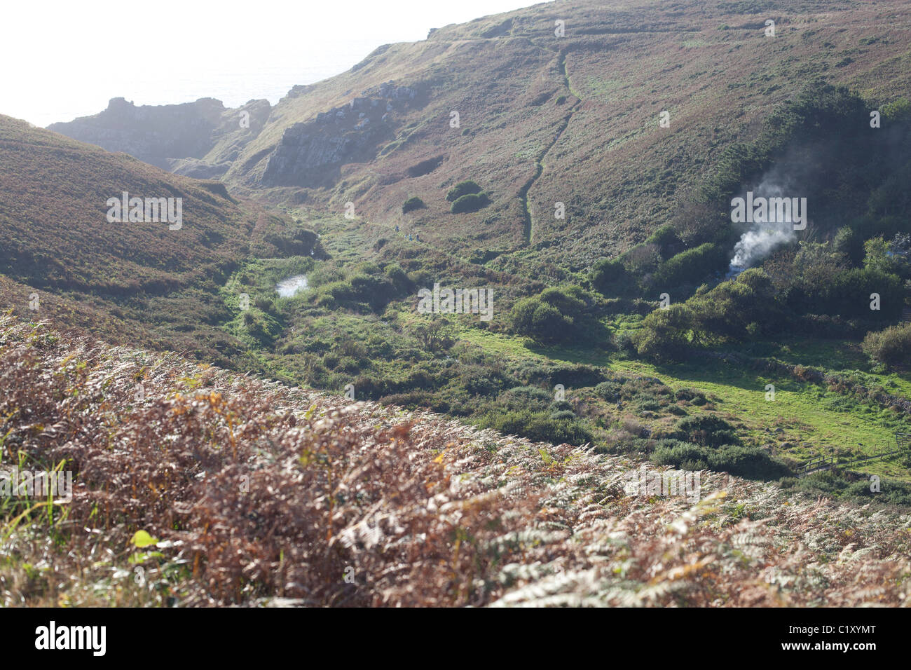 hilly landscape with smoke in west Cornwall Stock Photo