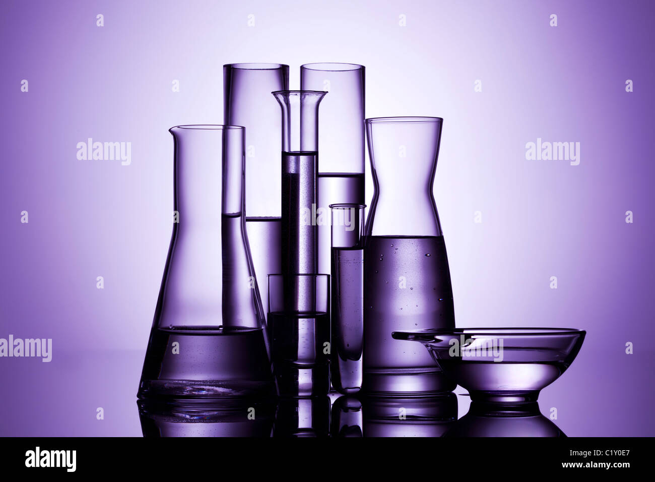 laboratory glassware, backlit, purple light Stock Photo Alamy