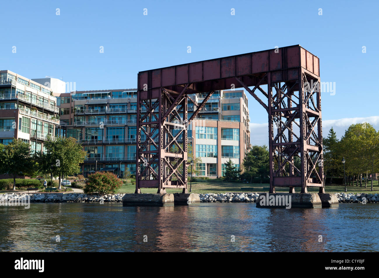 Bond Street Wharf office building and historic loading machinery, Baltimore harbour, Fell's Point, Maryland, USA Stock Photo