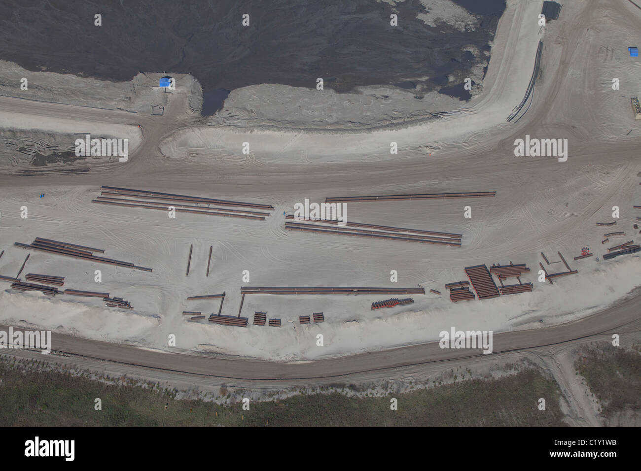 Industrial pipes on sands at Athabasca Oil Sands, aerial view, Fort McMurray, Alberta, Canada Stock Photo