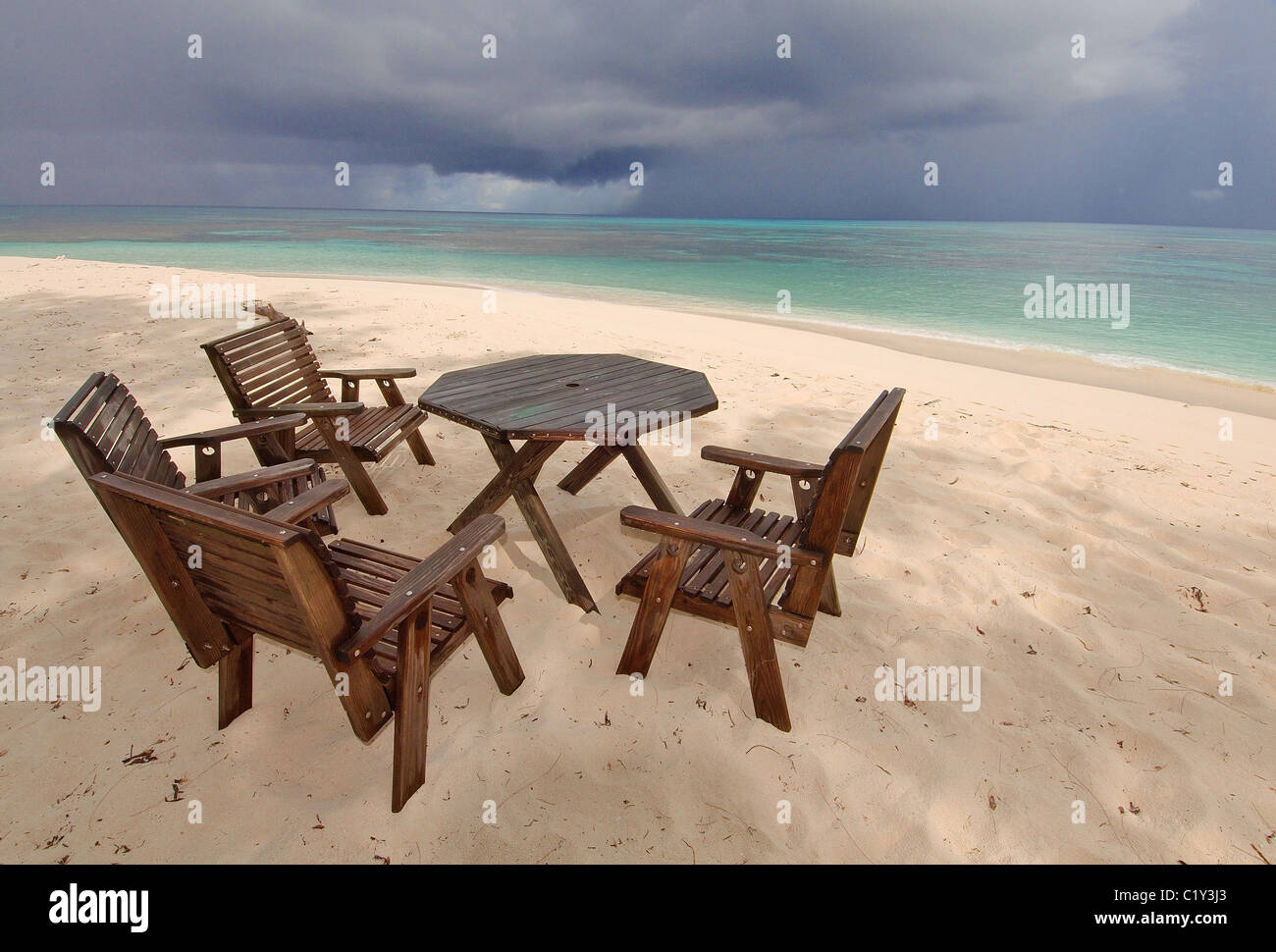 The wooden table and chairs on a beach Stock Photo Alamy