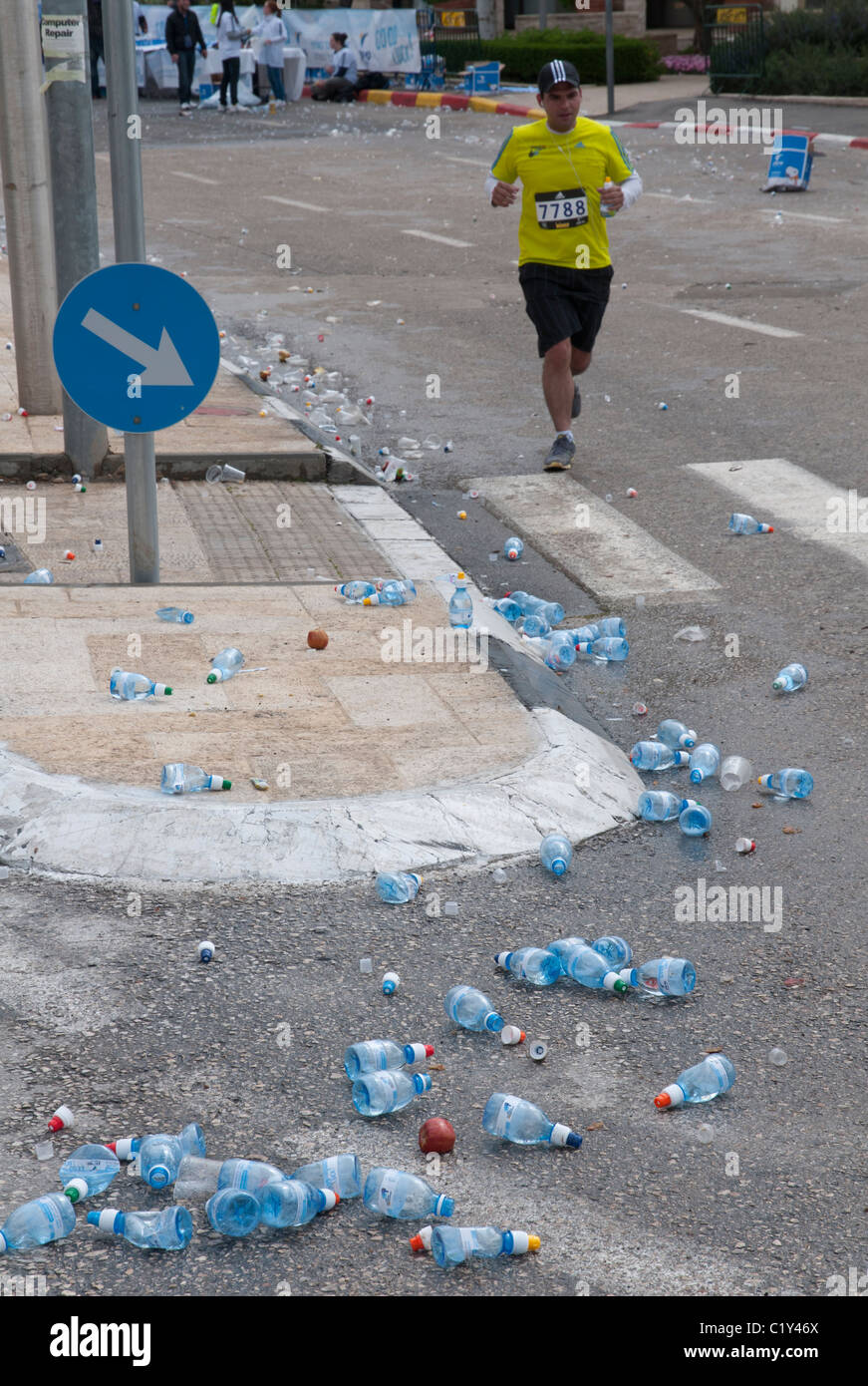 JERUSALEM, ISRAEL - March 25, 2011. The first International Jerusalem Marathon. Runners at drinking station Stock Photo