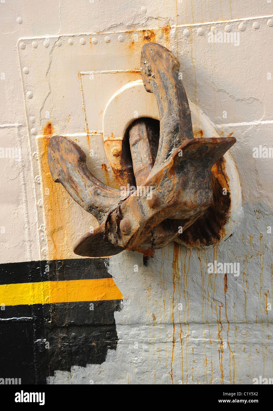 An old and rusty anchor on a ship in harbor Stock Photo