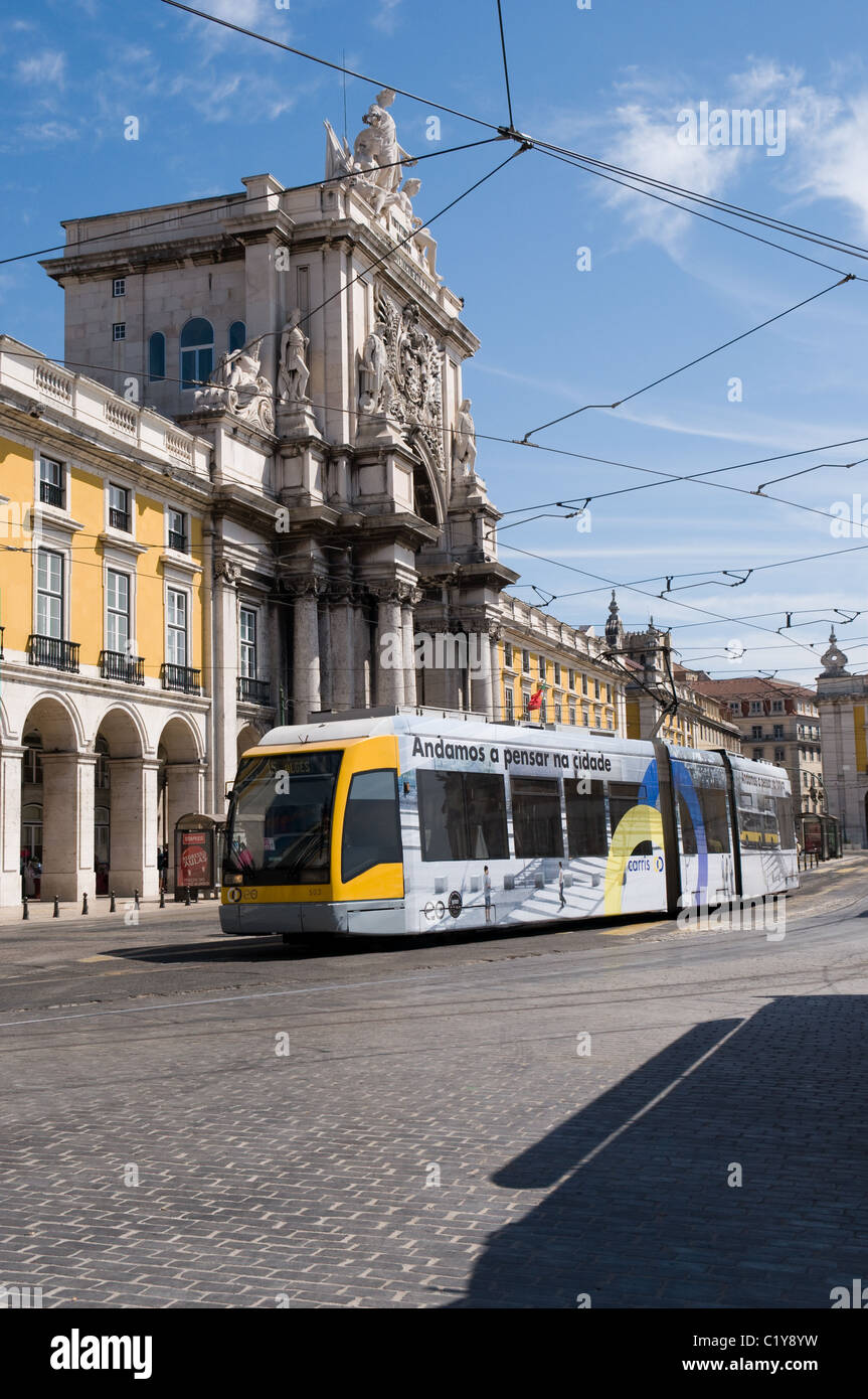 A modern Low floor tram passes through Praca do Commercio in Lisbon, Portugal Stock Photo