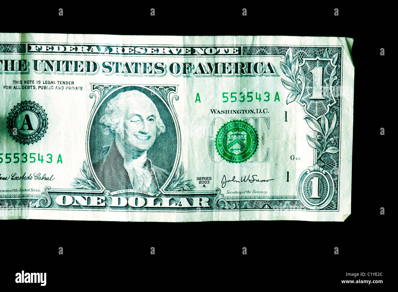 One dollar bill close up; George Washington is smiling and winking. Stock Photo