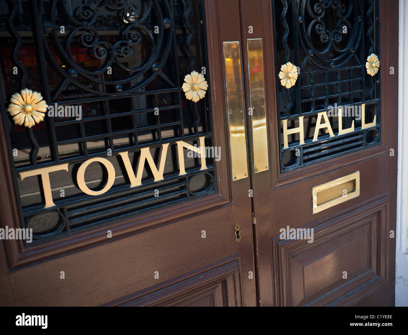 Town hall door sign local government office for elections, local matters meetings etc, with imposing ornate entrance doors & letter box England UK Stock Photo