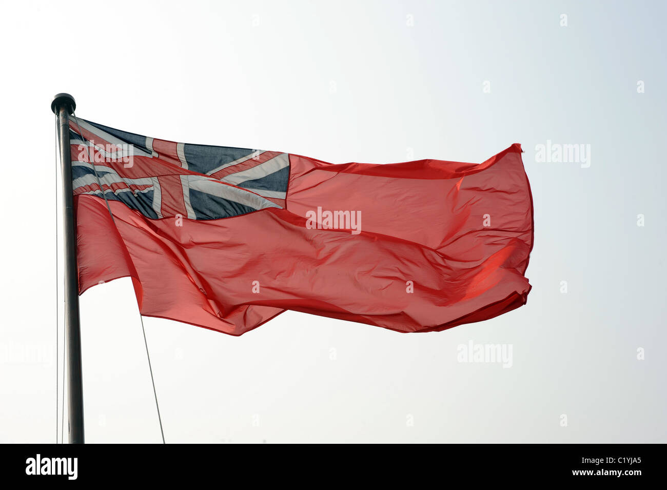 The red ensign (red duster) flown by merchant shipping registered to great Britain. Stock Photo