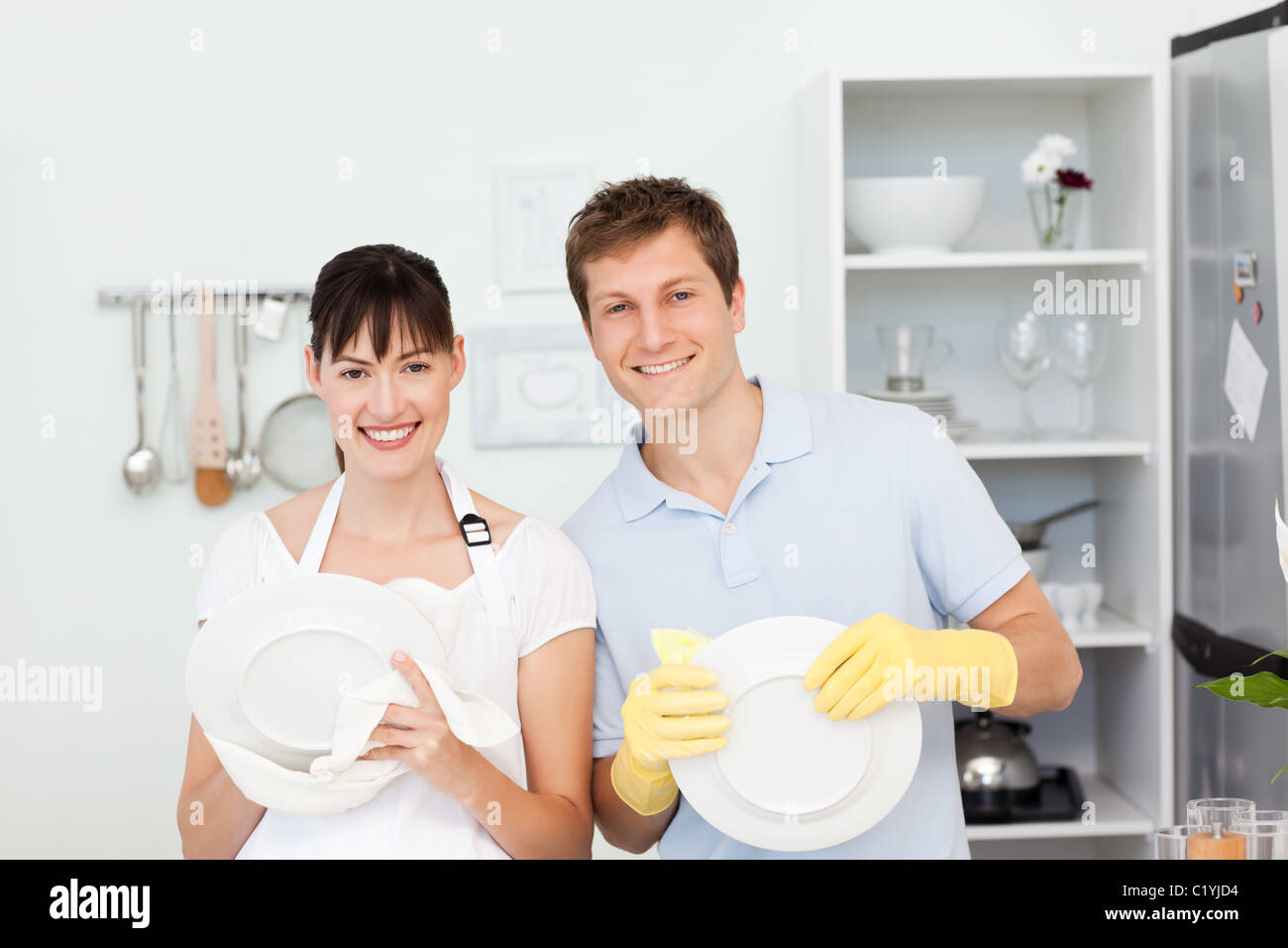 Lovers washing dishes together Stock Photo Alamy