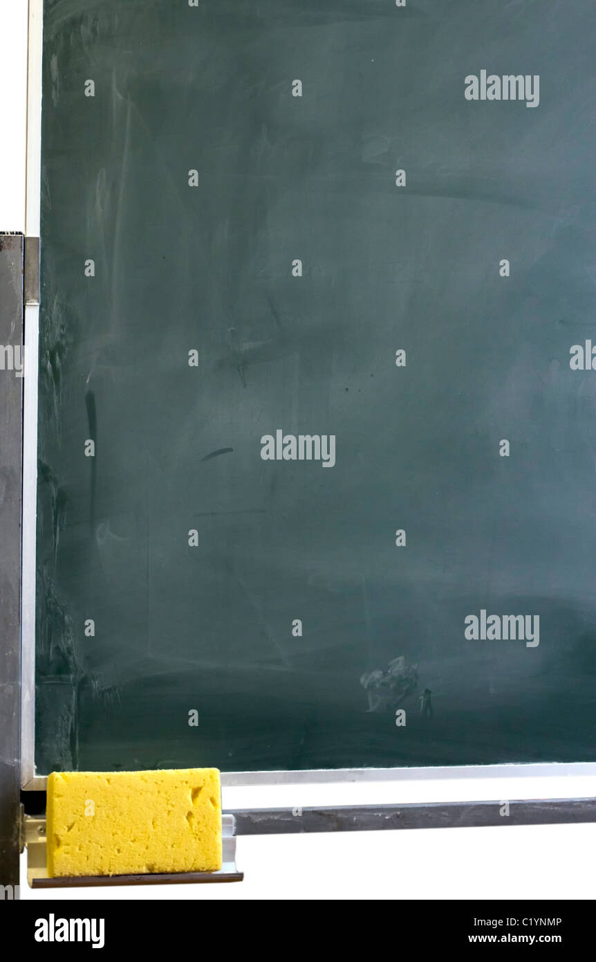 Part of dirty blackboard with sponge. Stock Photo