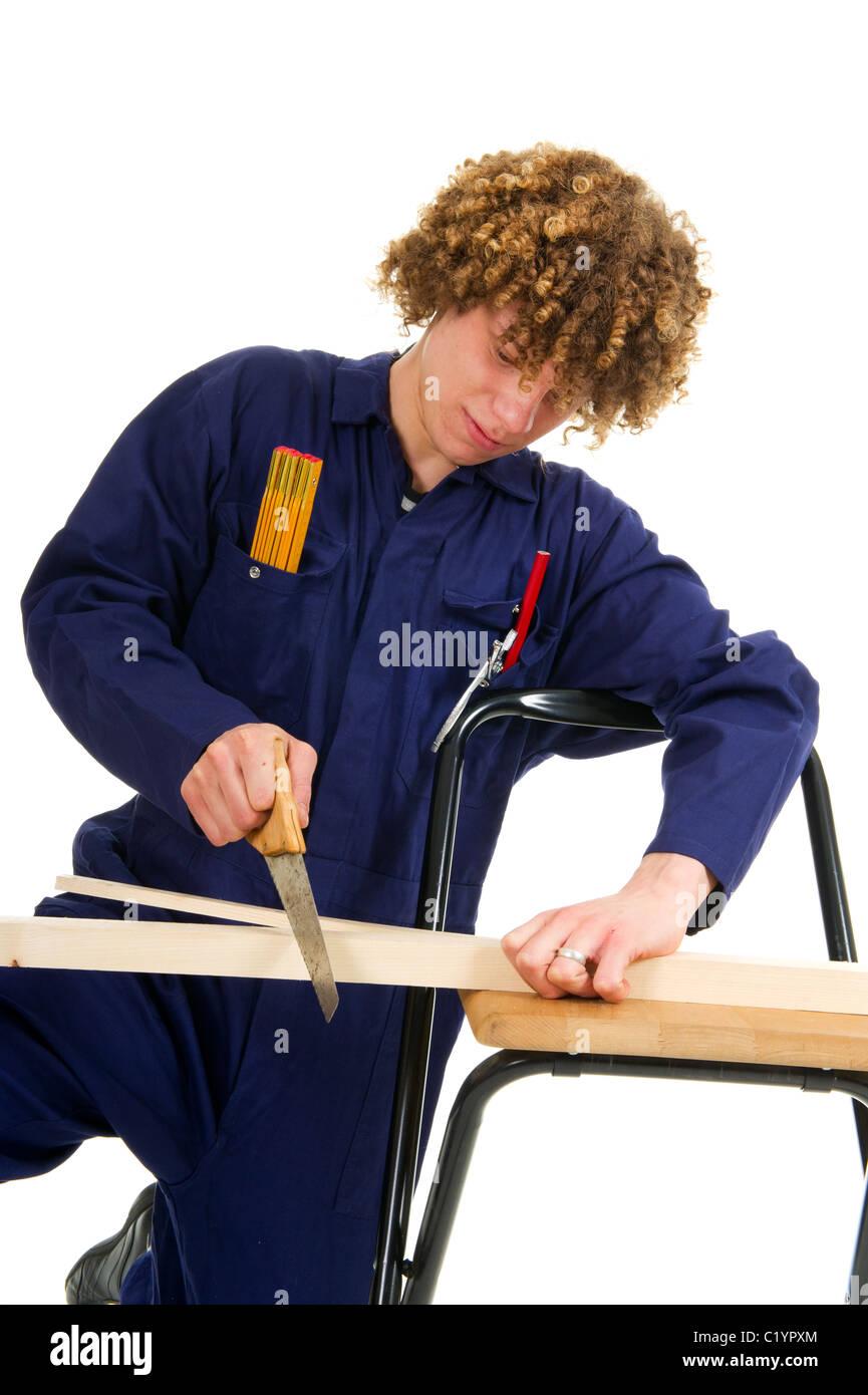Young boy working as carpenter with timbers and tools Stock Photo - Alamy