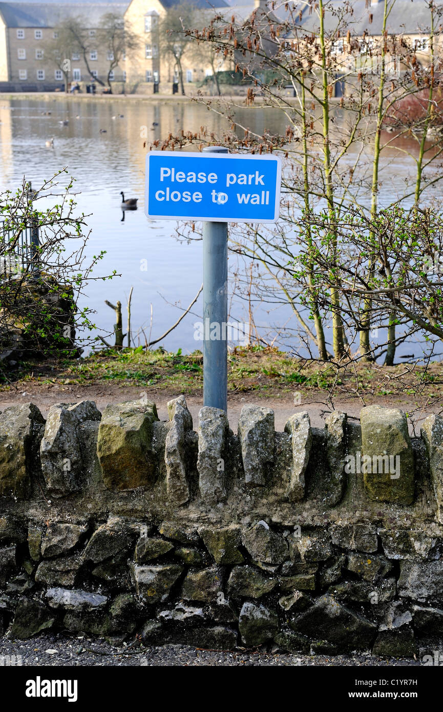 please park close to the wall sign car park bakewell Derbyshire england