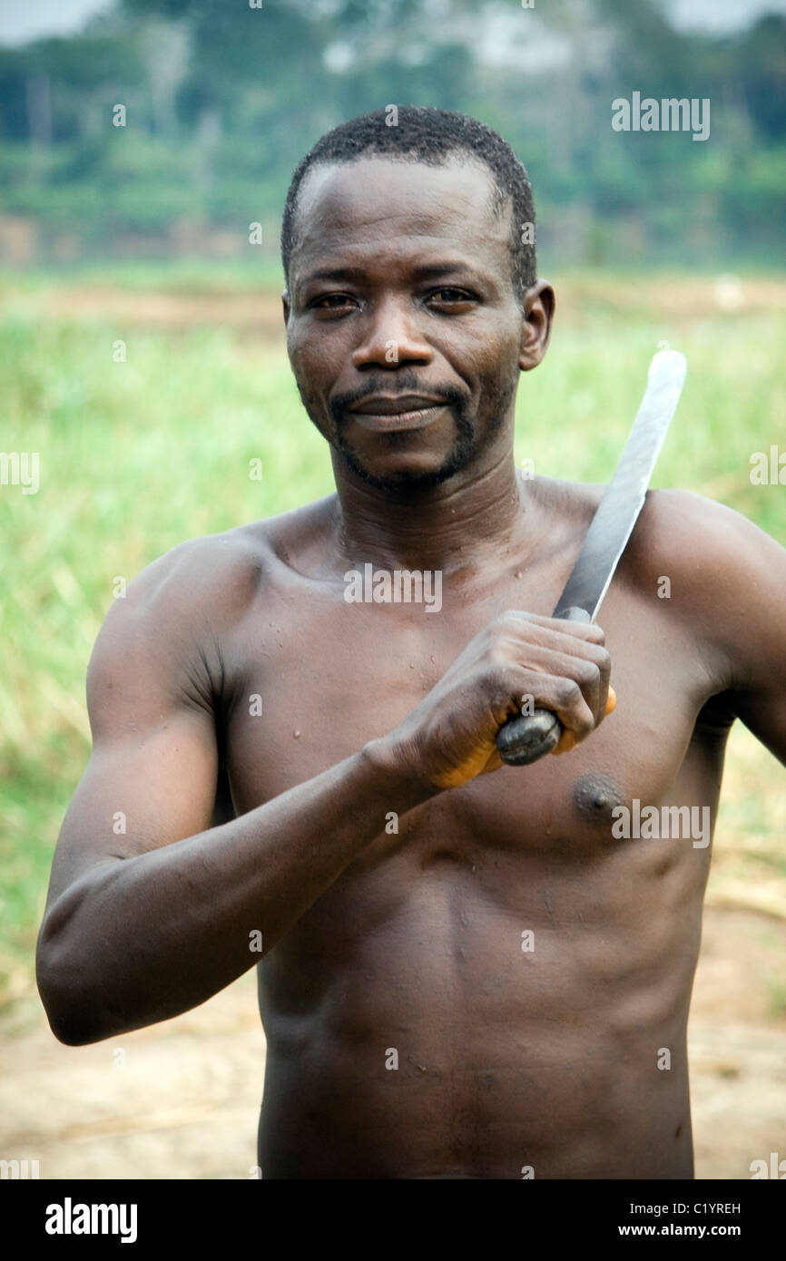 A man with a machete ,Betou,Ubangi River,Republic of Congo Stock Photo