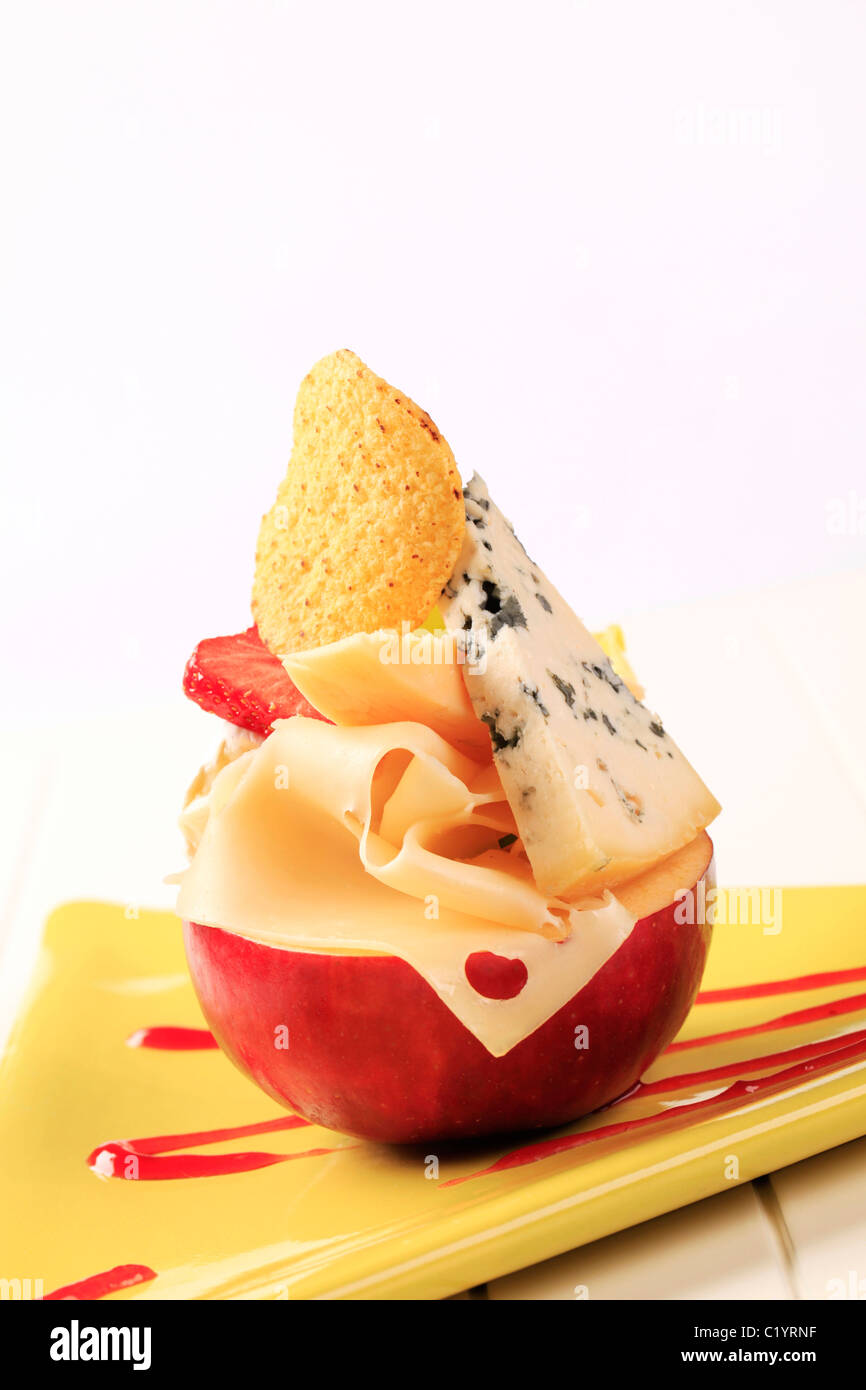 Pieces of cheese on a red apple Stock Photo - Alamy