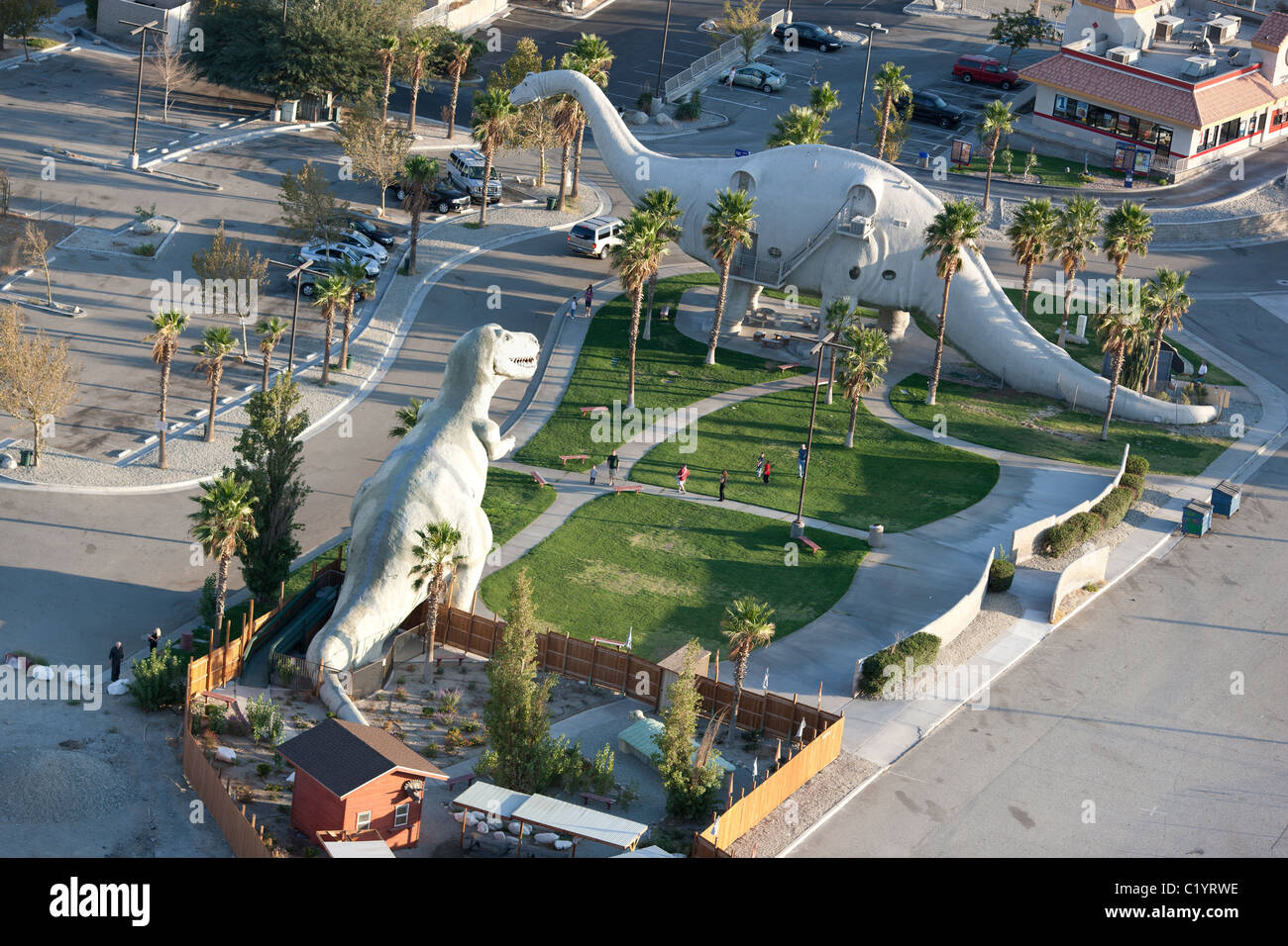 AERIAL VIEW. Tyrannosaur and brontosaur as a roadside attraction and museum alongside interstate 10 in Cabazon. San Bernardino County, California, USA Stock Photo