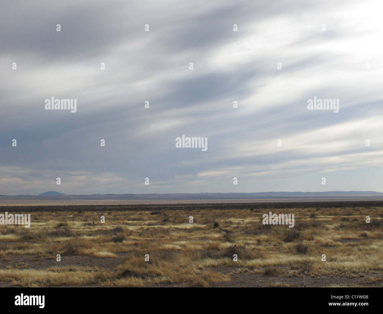 Cloudy Sky and desert near Marfa, Texas - background Stock Photo