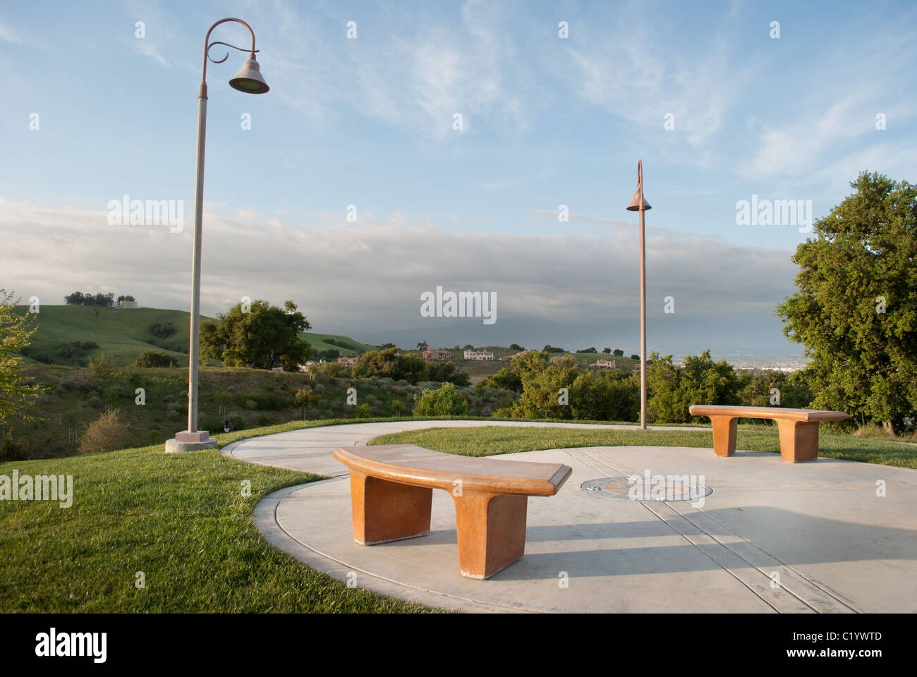 Empty benches in a hillside park Stock Photo - Alamy