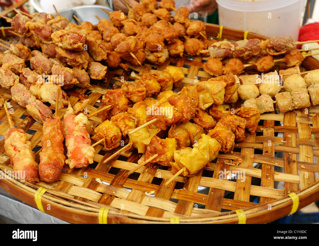 deep fried savoury snacks in batter , street snacks , bangkok, thailand