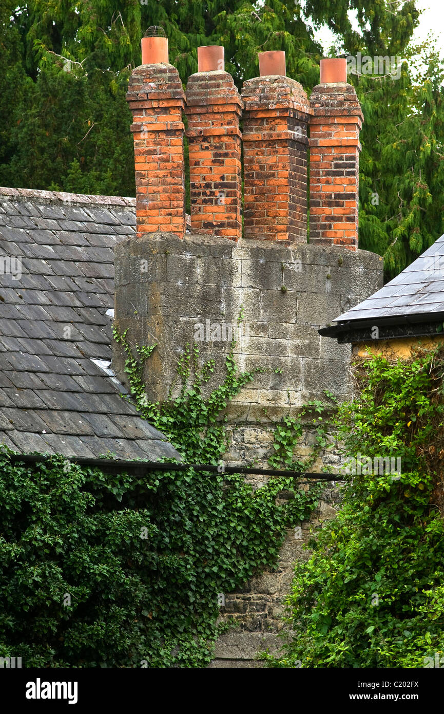 four chimneys on roof Stock Photo