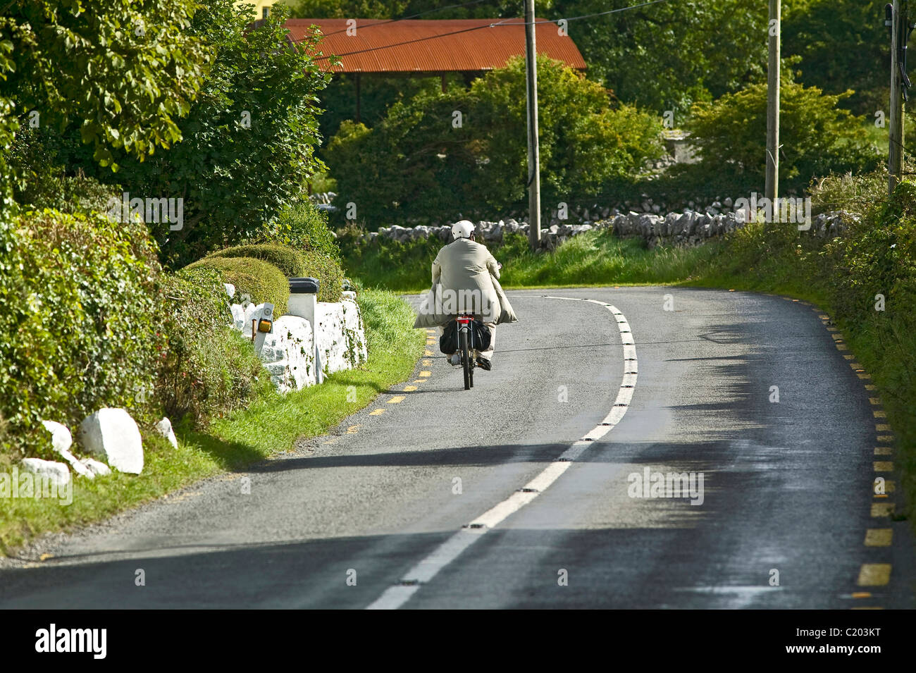 moped on the road in Ireland Stock Photo