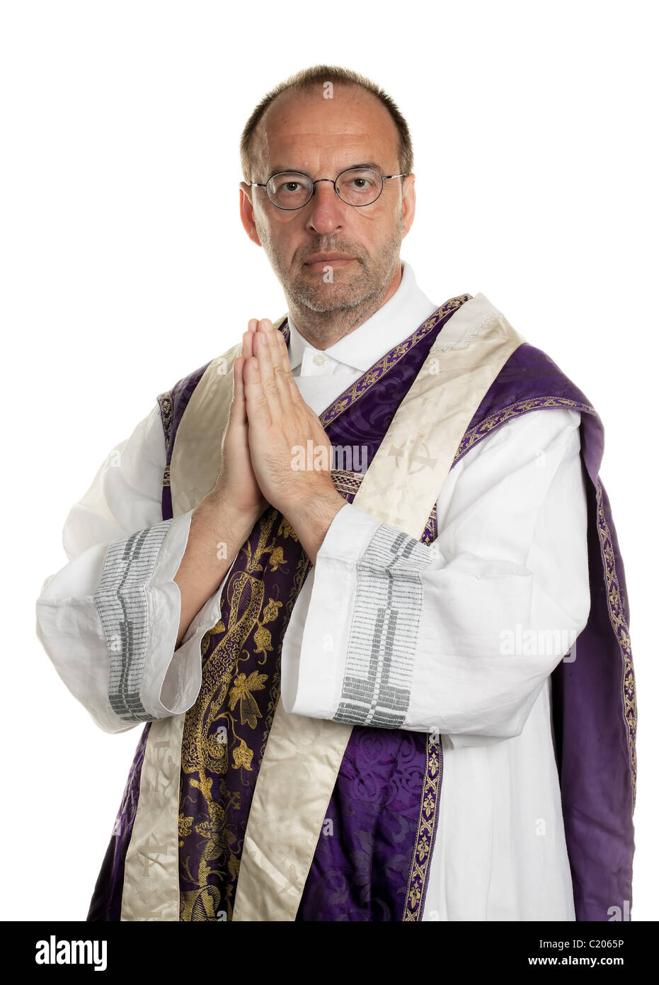 Catholic priests in prayer in worship Stock Photo Alamy