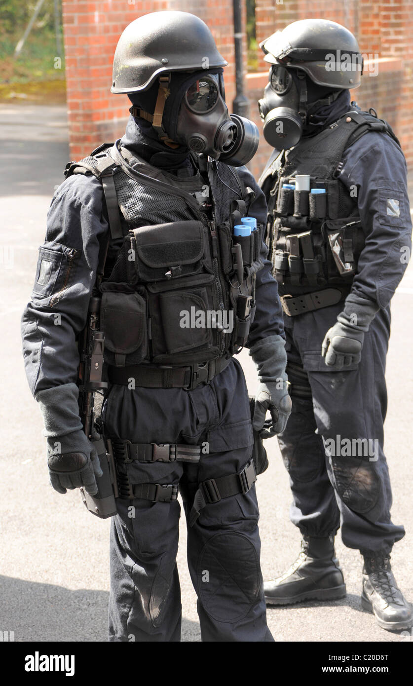 SWAT police officers armed and with gas masks. Real police special weapons team - not a reconstruction. Stock Photo