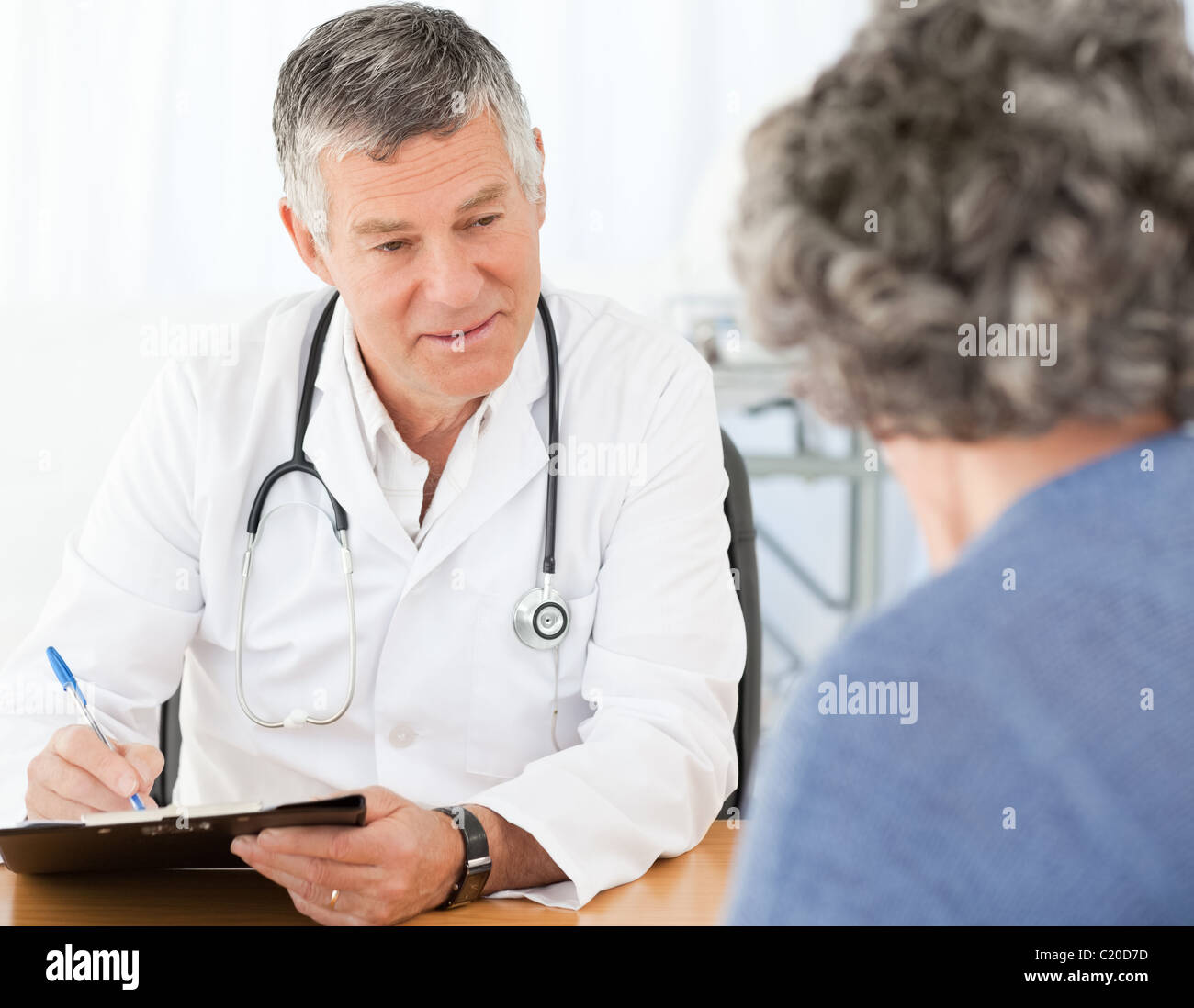 A Senior Doctor Talking With His Patient Stock Photo Alamy