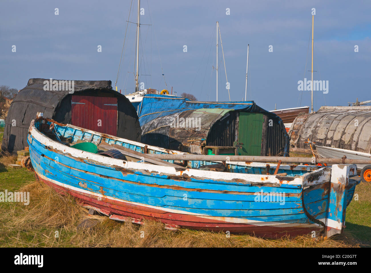 Boats as huts, Holy Isle, Northumberland, England Stock Photo