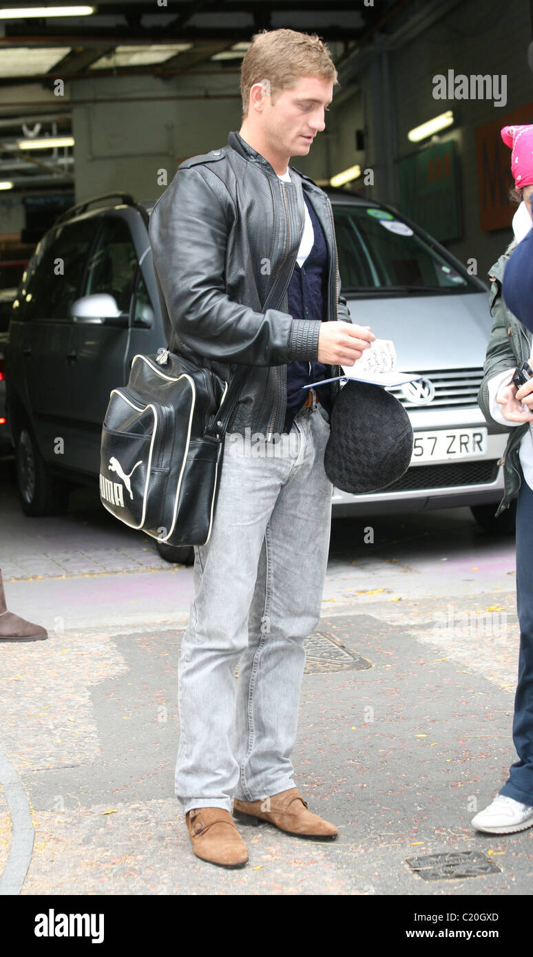 Brookside soap star, Philip Olivier wearing a flat cap at the This