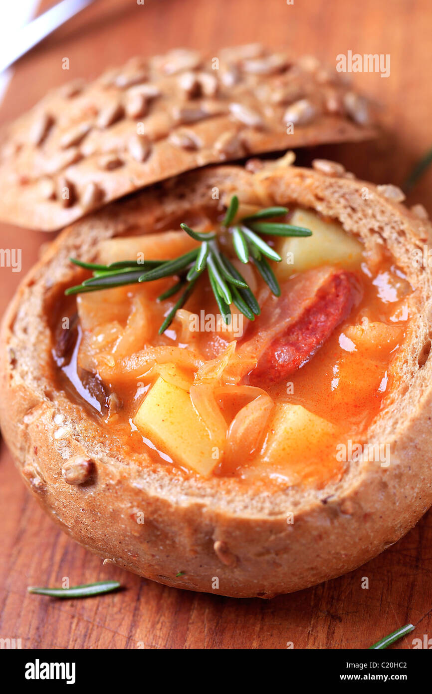 Sauerkraut soup with potatoes and sausage served in a bread bowl Stock Photo Alamy