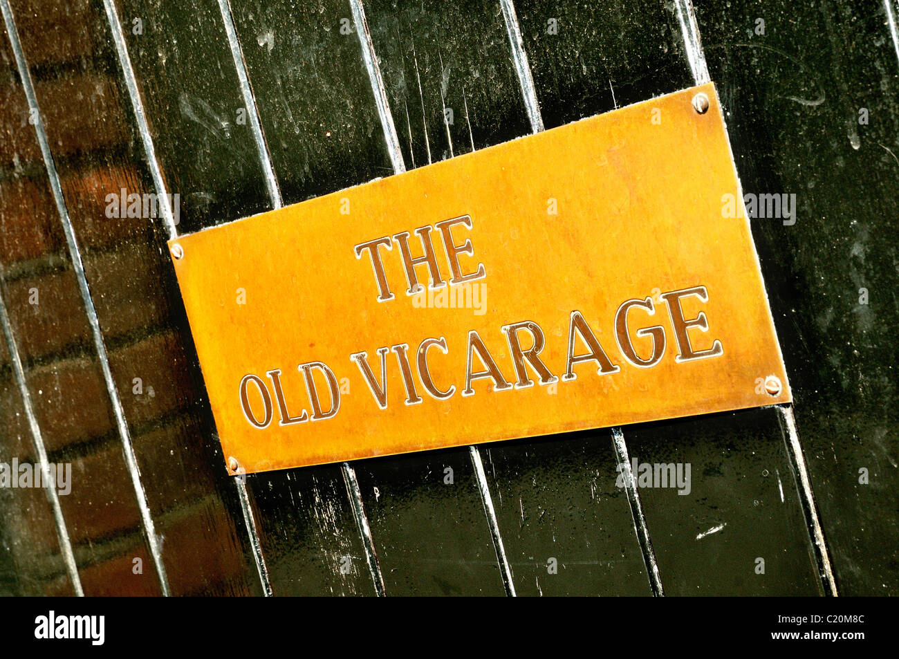 'The Old Vicarage' brass nameplate on door Stock Photo