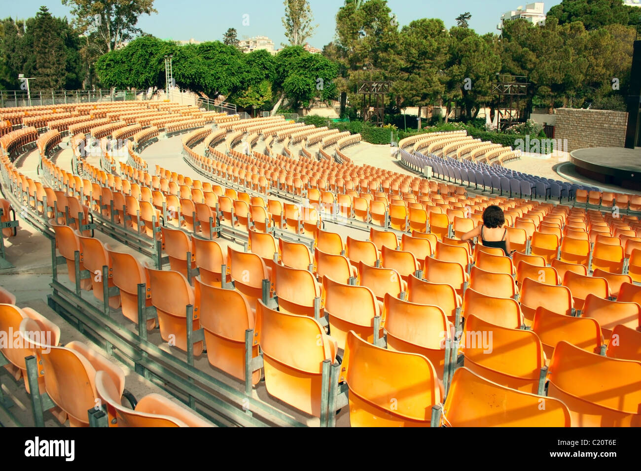 Plastic yellow chairs in summer amphitheater Stock Photo Alamy