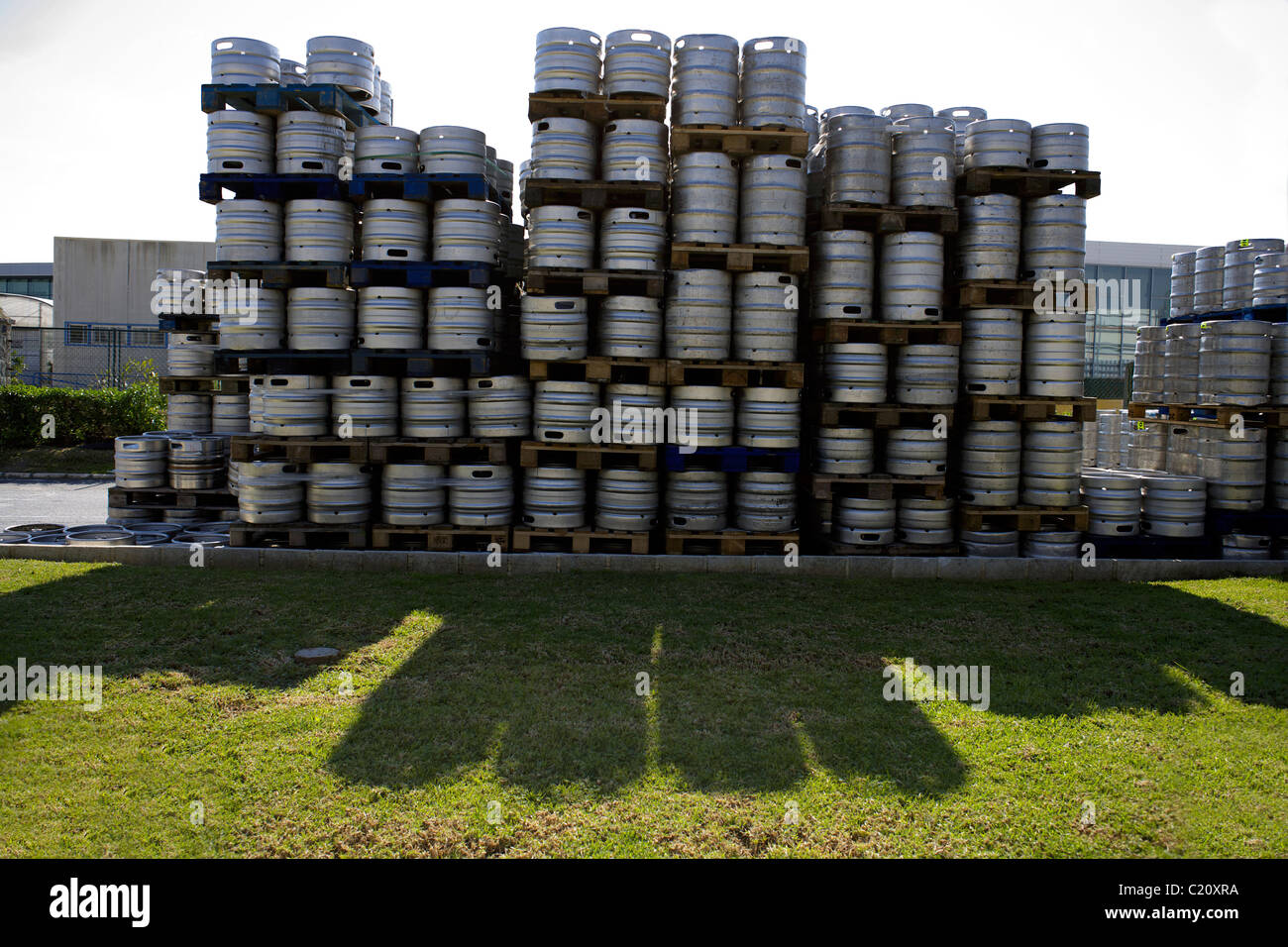 Stack of aluminum beer barrels, kegs, barrel, keg, stacks, aluminium, grass, shadow, Stock Photo