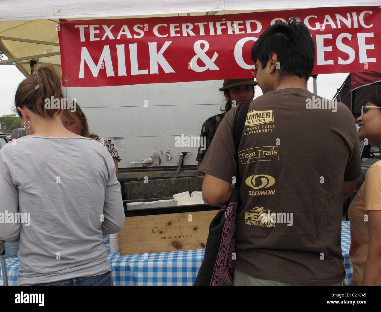 People at a dairy vendor at the farmers' market. Stock Photo