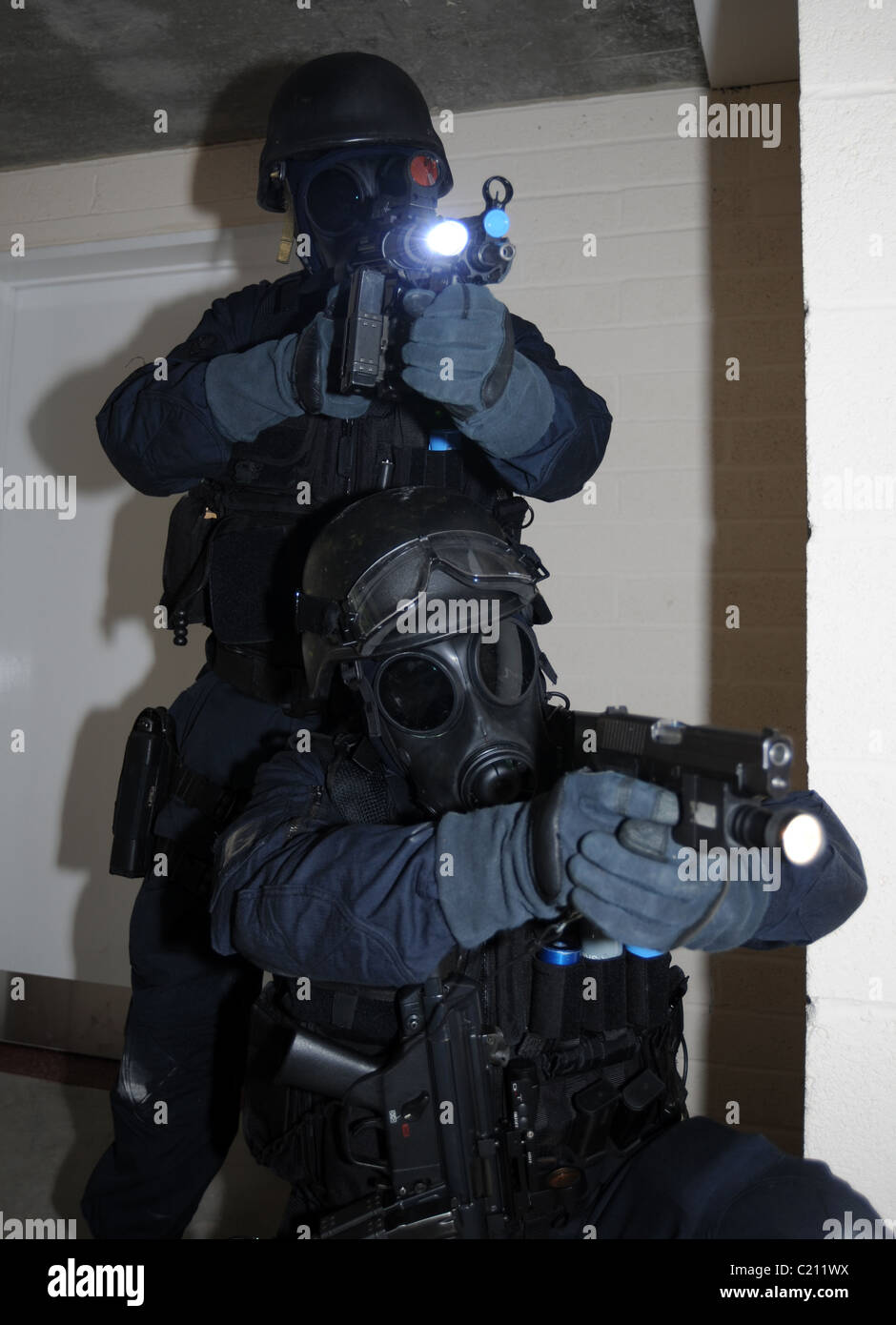 SWAT officers armed with pistols and gas masks. Real police, not a reconstruction Stock Photo
