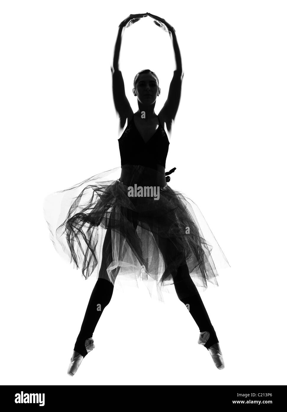 one beautiful caucasian woman ballet dancer dancing leap jumping full length on studio isolated white background Stock Photo