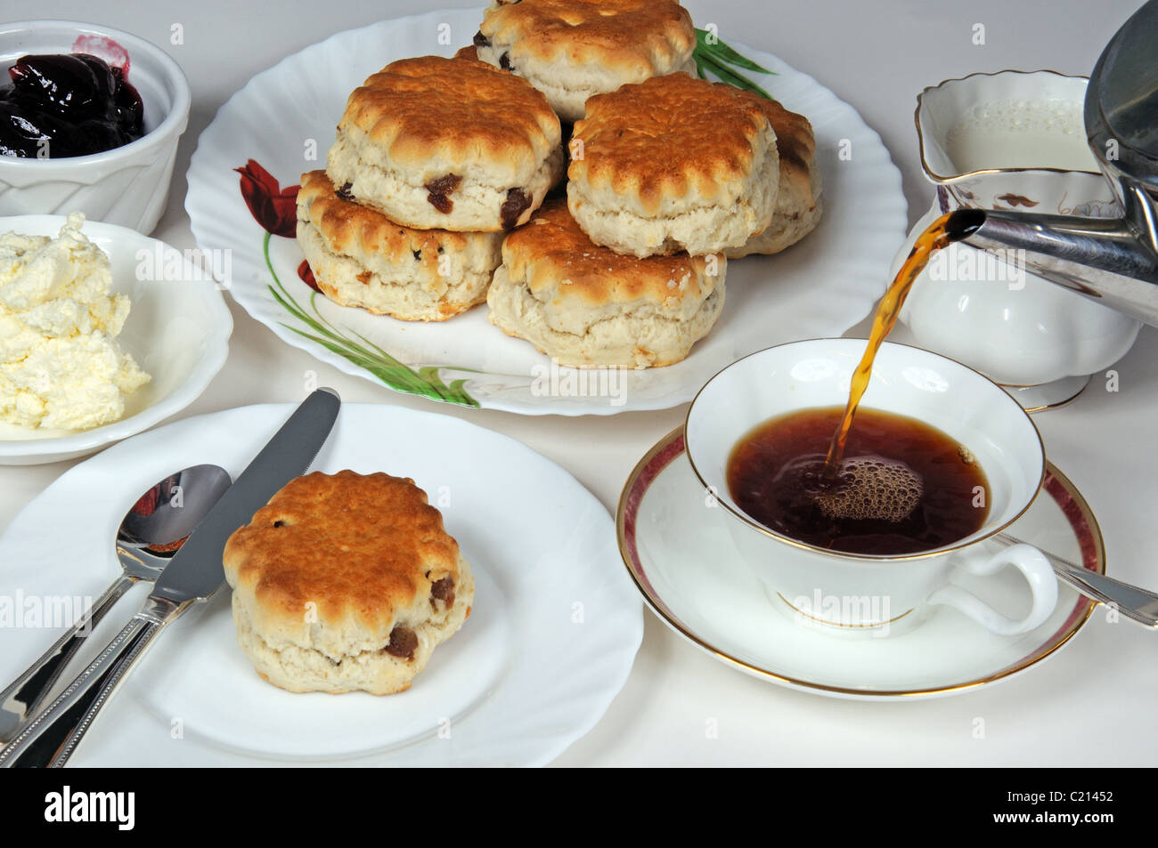 Scones with strawberry jam and clotted cream. Stock Photo