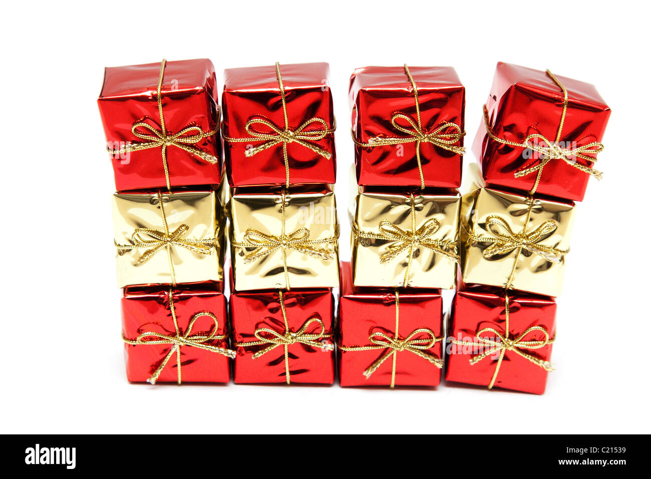 Gift red boxes with gold bows on a white background Stock Photo - Alamy