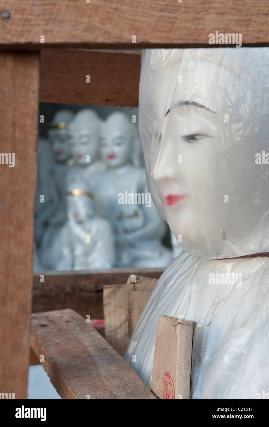 Budha statue wrapped in plastic sheet. Shwedagon. Yangon. Myanmar Stock Photo