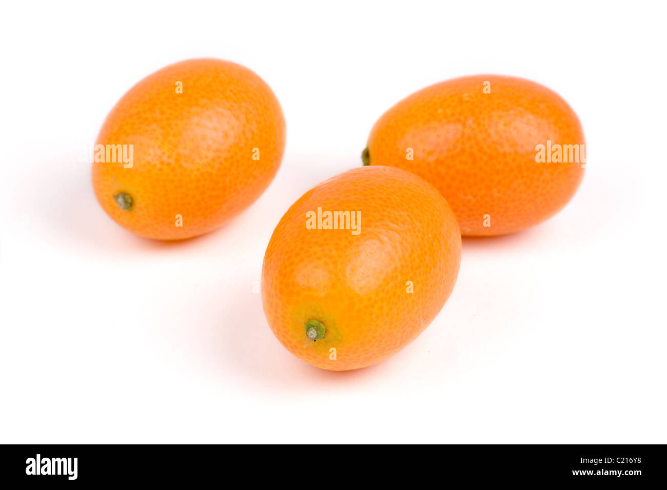 isolated kumquat, The fruit has a sweet outer skin and a tart inner