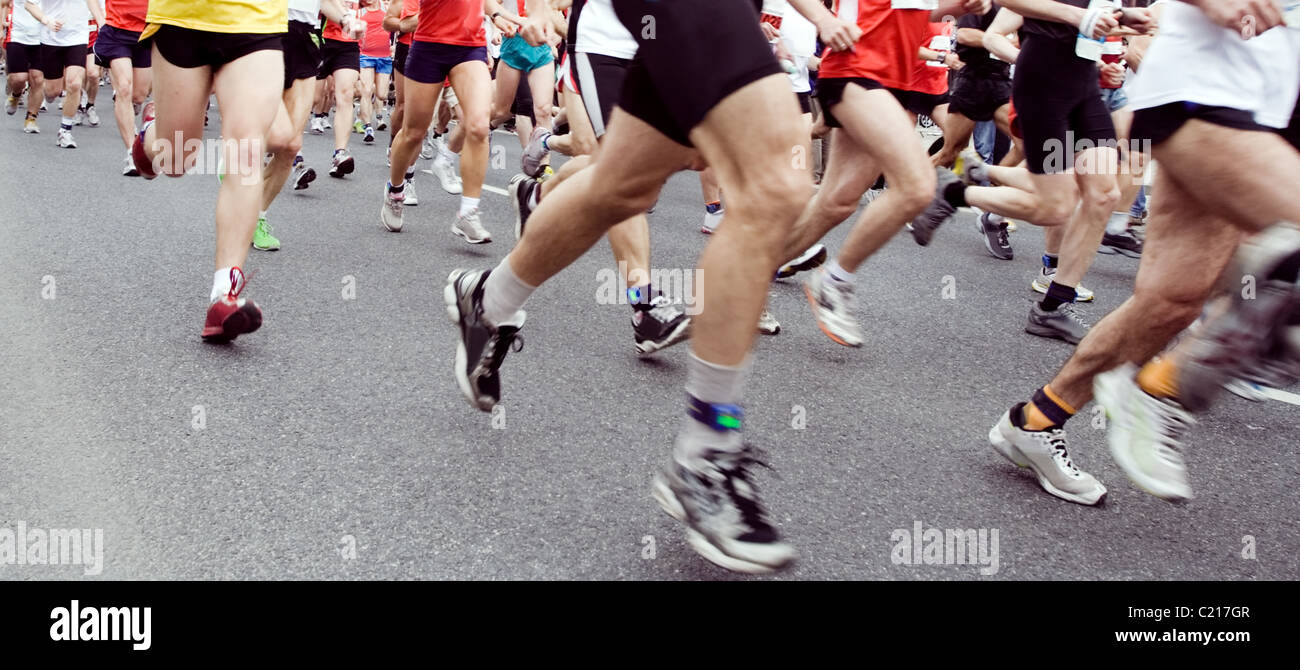 Runners running in marathon race in city Stock Photo