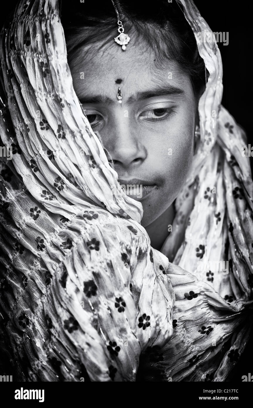 Happy Indian girl wearing a black shawl. Monochrome Stock Photo