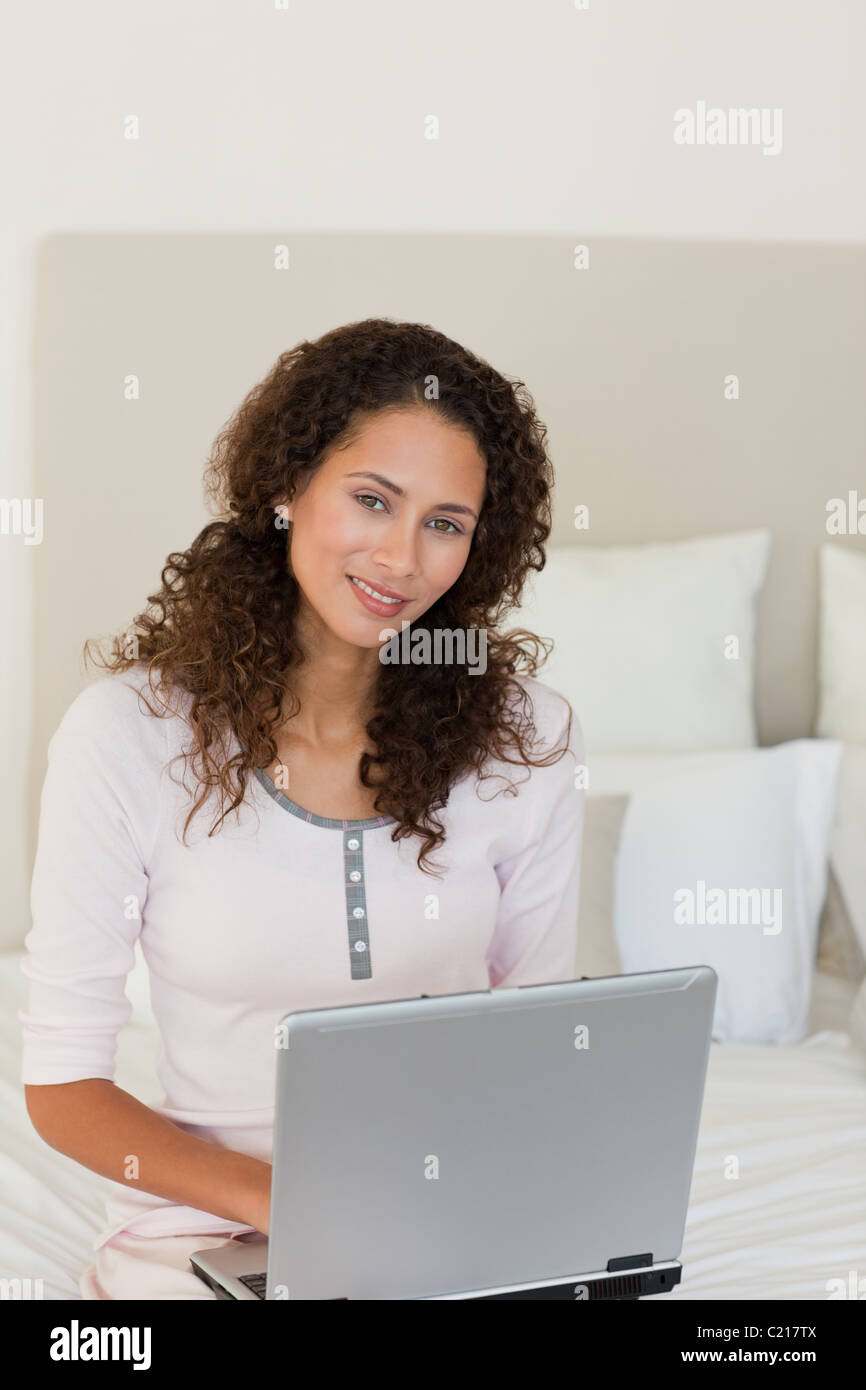 Attractive woman working on her laptop Stock Photo - Alamy