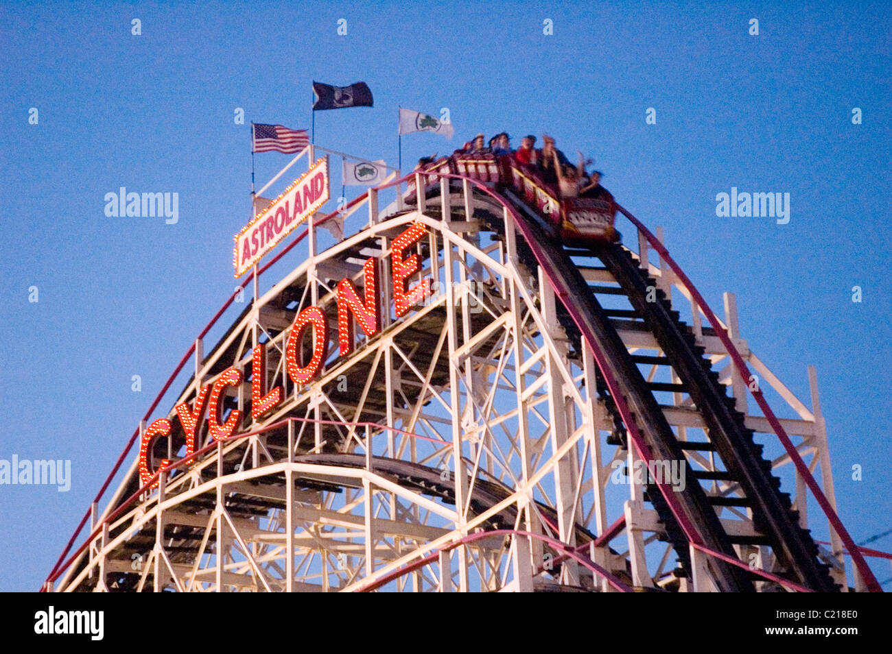 Cycolone Rolercoster People riding the Coney Island Cyclone Roller coaster in the summertime ...
