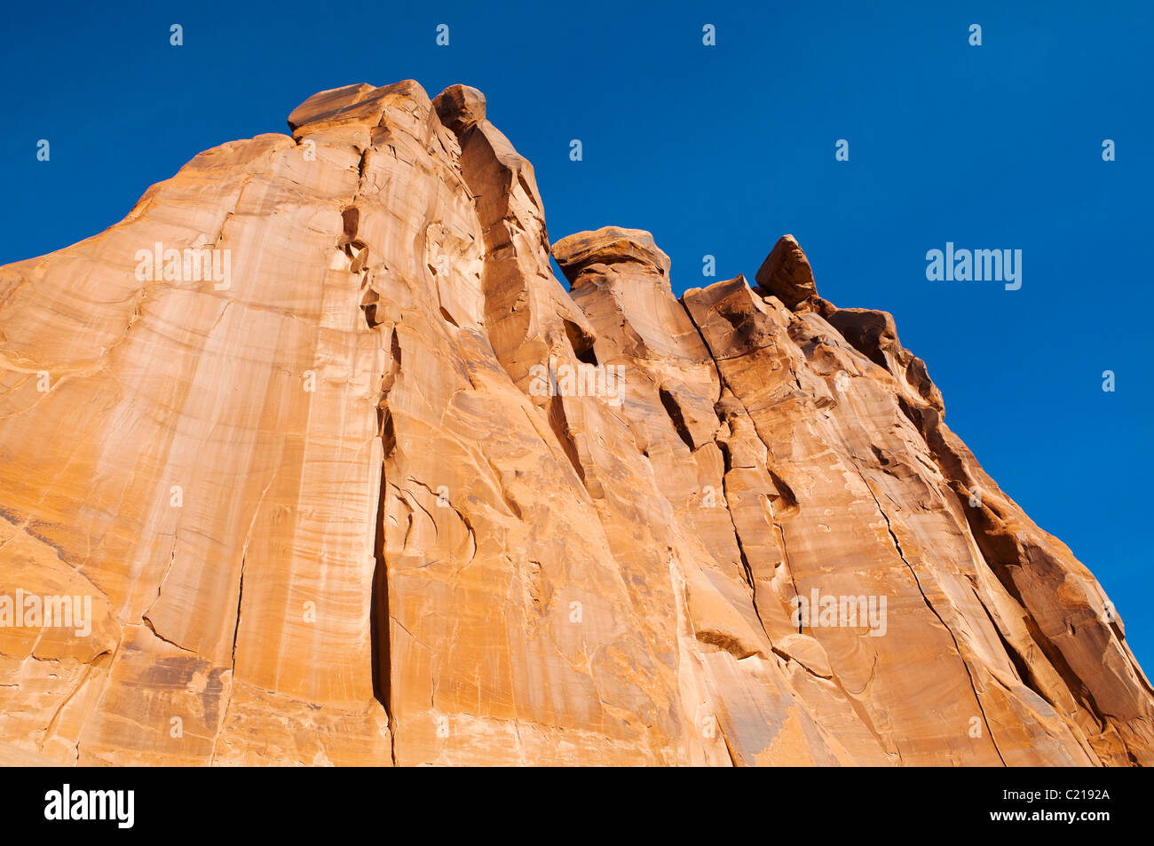 Looking up at The Three Gossips rock formation in Arches National Park