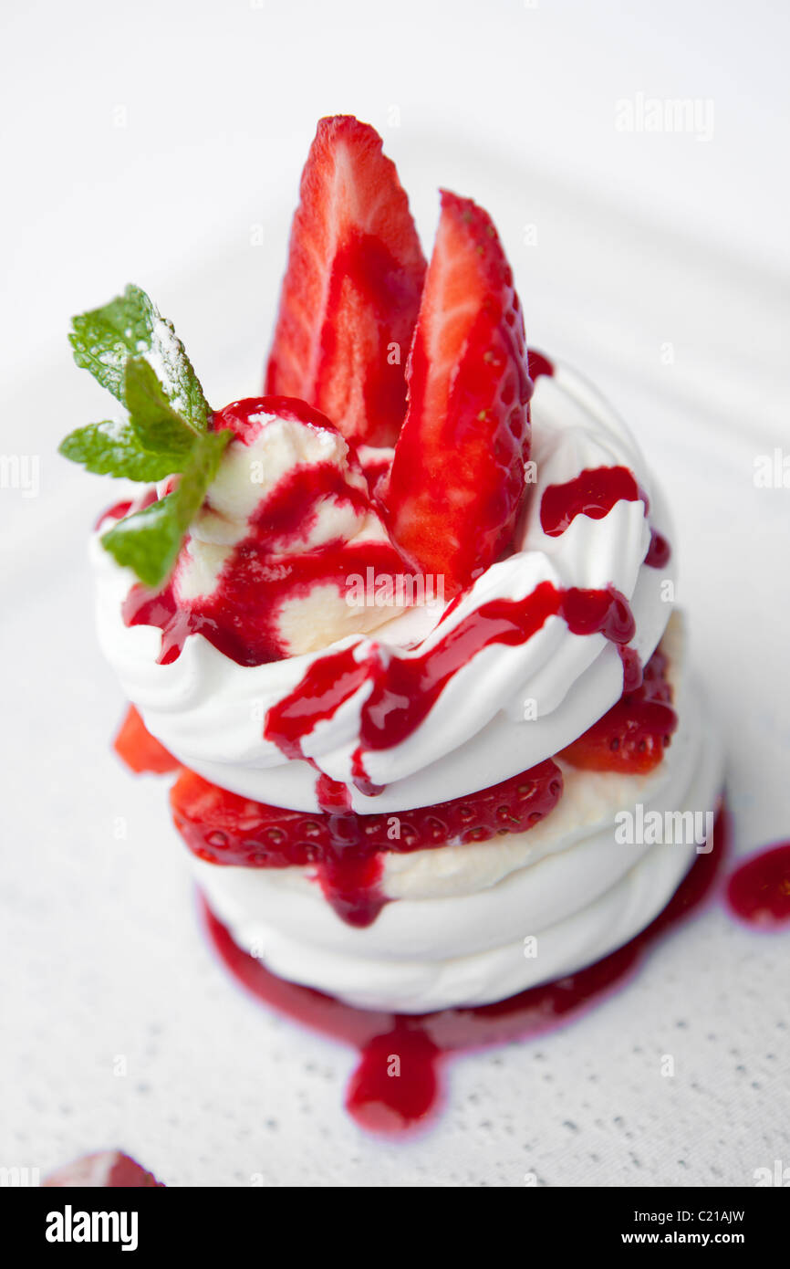Strawberry meringue with cream and strawberry coulis Stock Photo Alamy