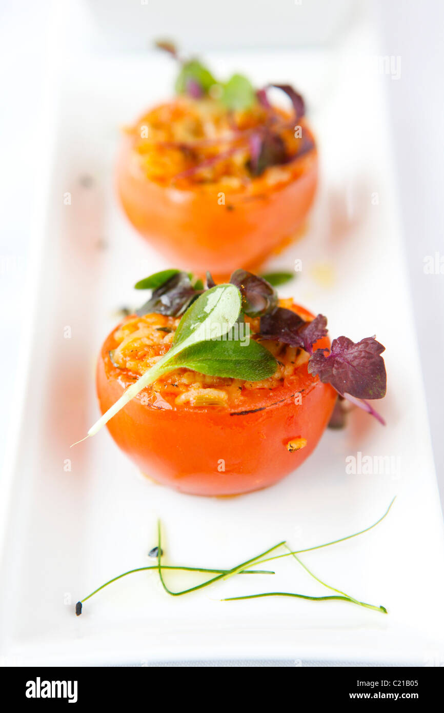 Starter of rice stuffed tomatoes. Stock Photo