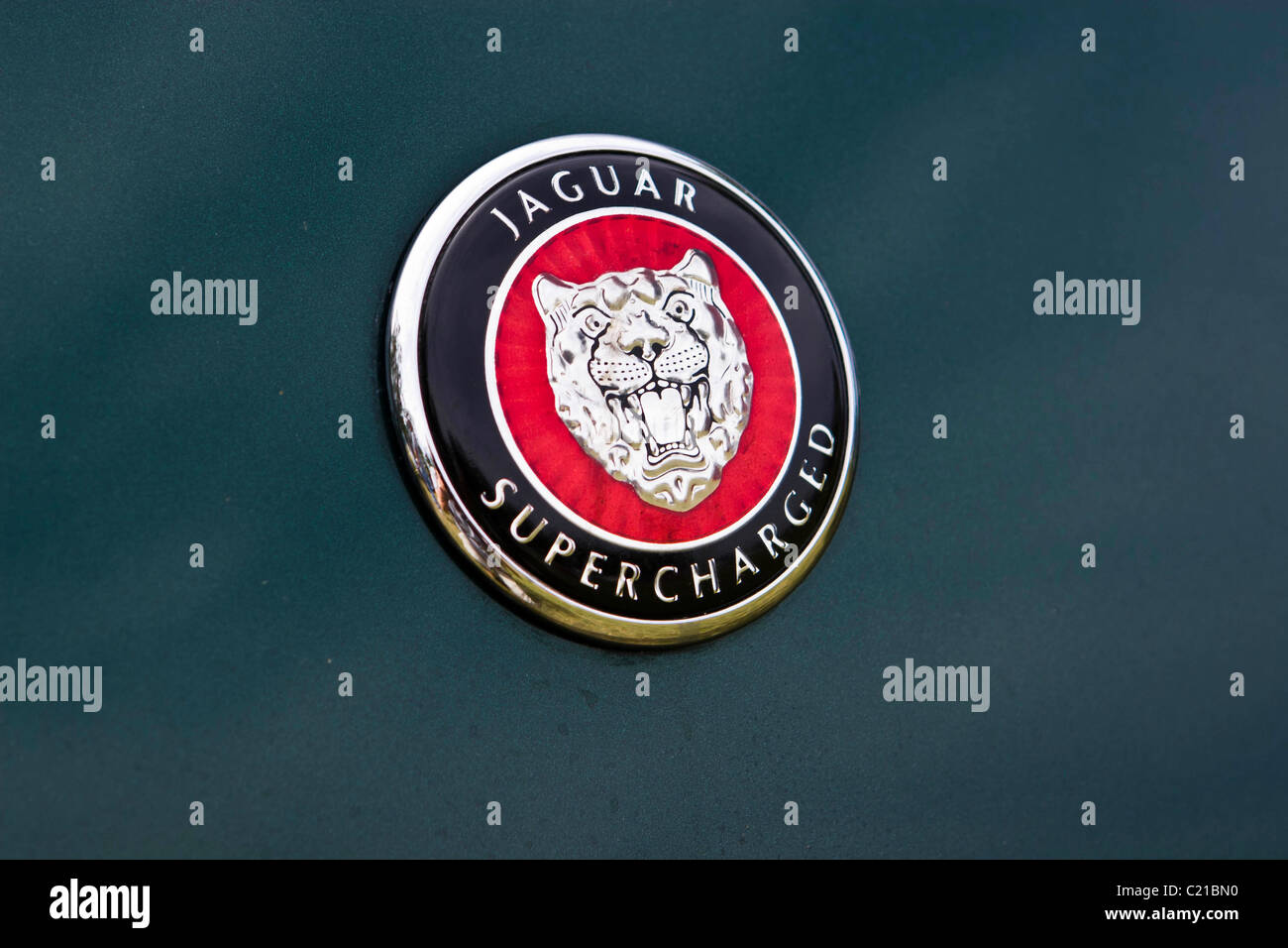 Badge from supercharged Jaguar car Stock Photo