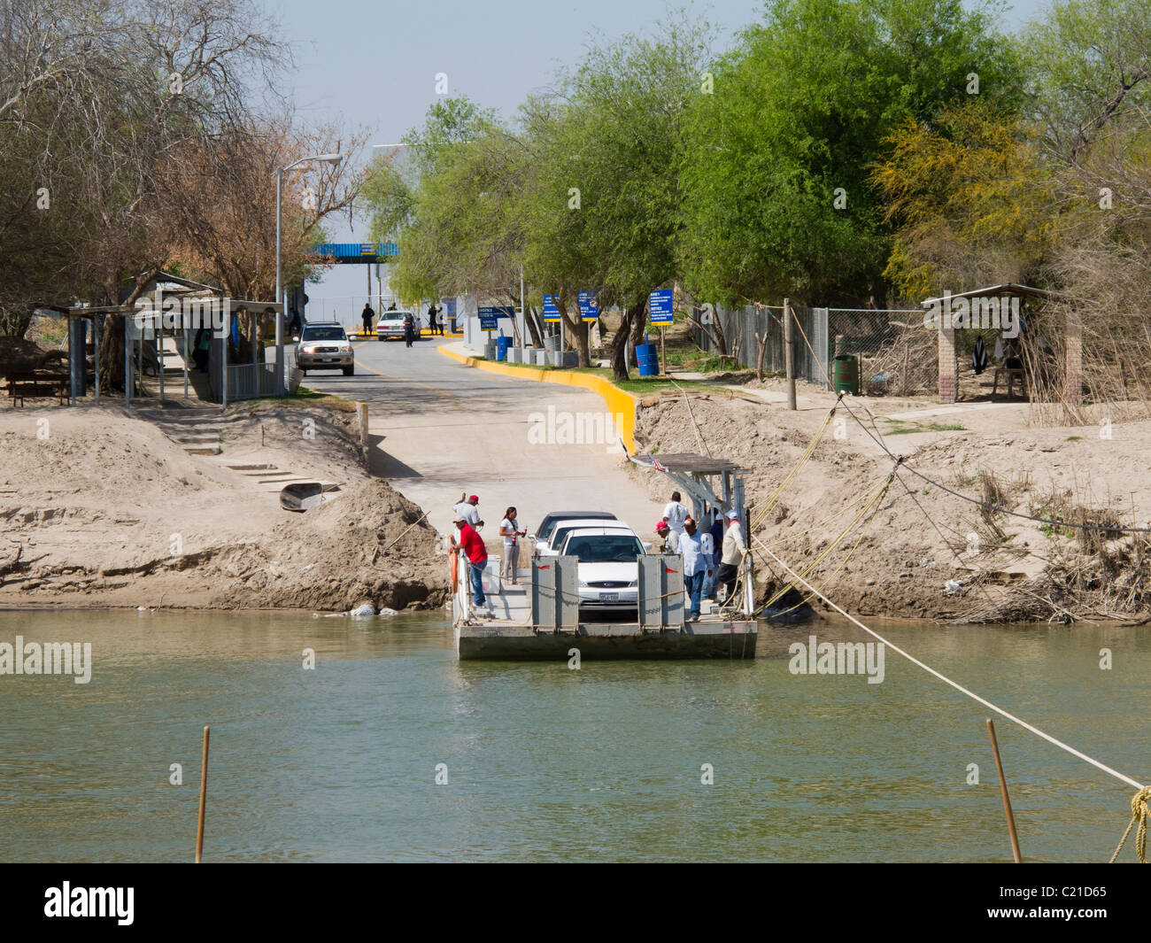 Hand pulled ferry crossing the Rio Grande River at Los Ebanos, TX Stock