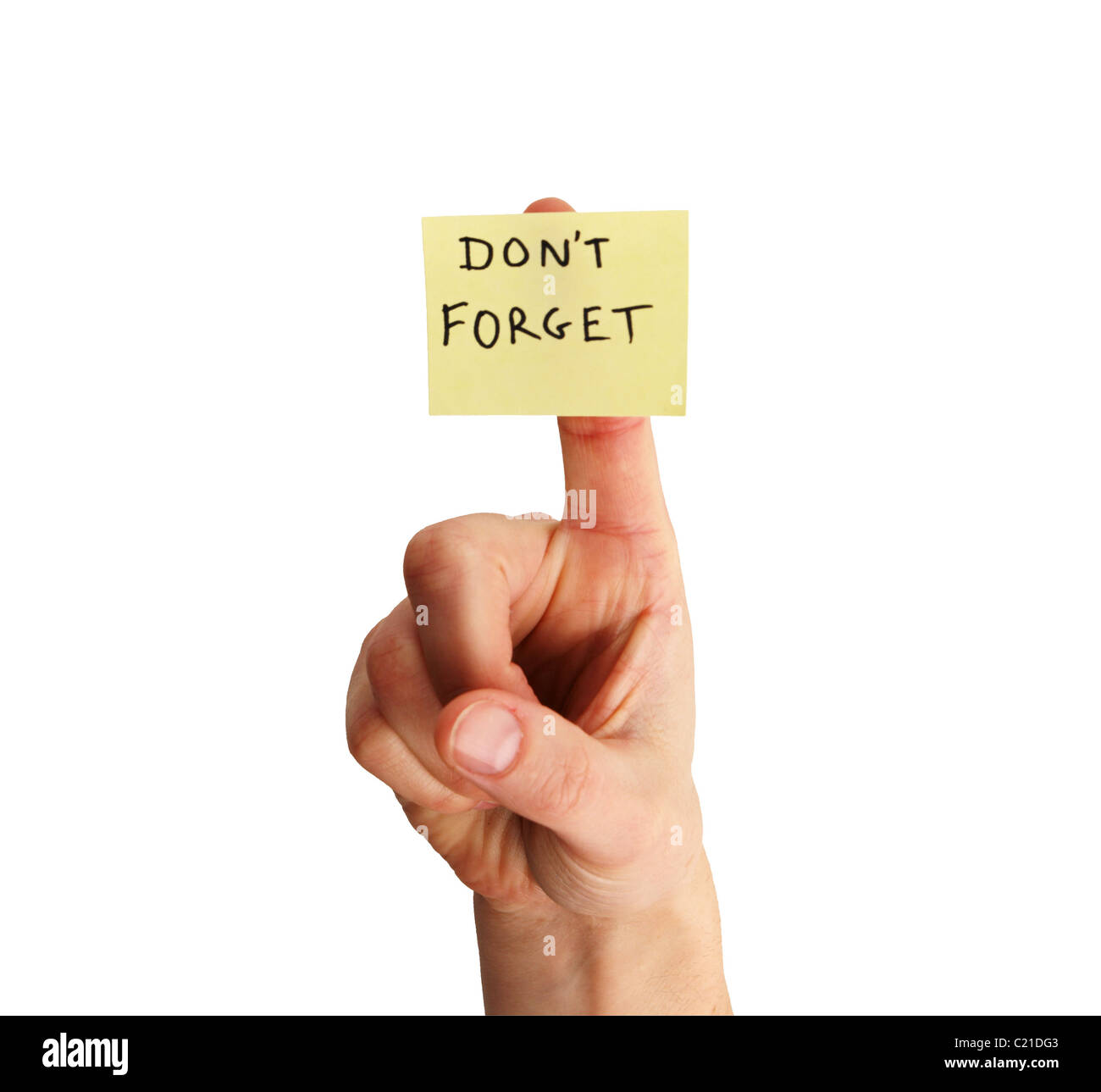 yellow sticky note saying don't forget on a woman's finger isolated on white background Stock Photo