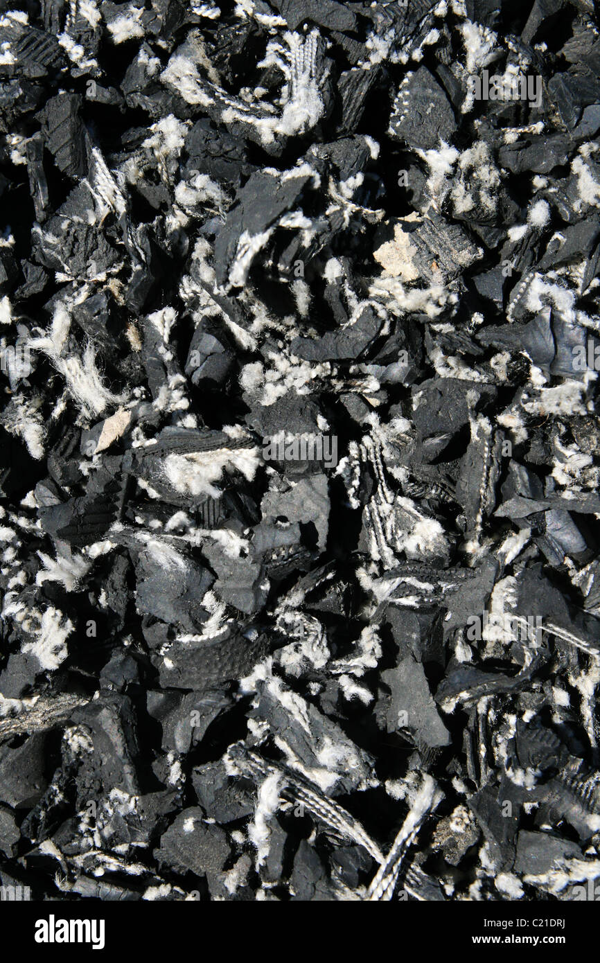 background close up of shredded pieces of rubber tire Stock Photo